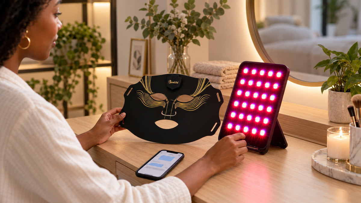 Woman comparing home red light therapy devices, including an LED face mask and tabletop panel.