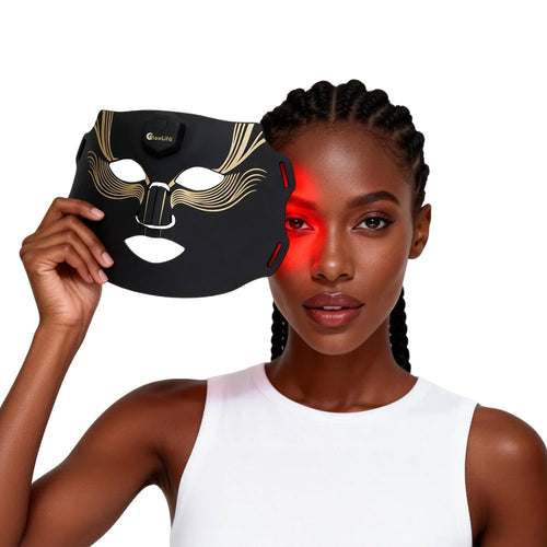 Woman holding the Diamond Edition wireless LED mask beside her face