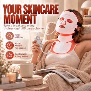 Woman relaxing at home while wearing the VanqHeal LED face and neck mask set, with the controller beside her.