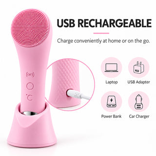 Electric facial cleansing brush with USB cable and charging icons for a laptop, adapter, power bank and car.