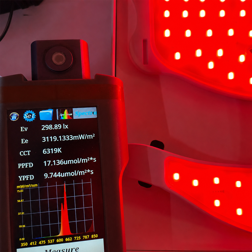 Spectrometer testing VanqHeal face and neck LED mask with red light LEDs and visible spectrum readings