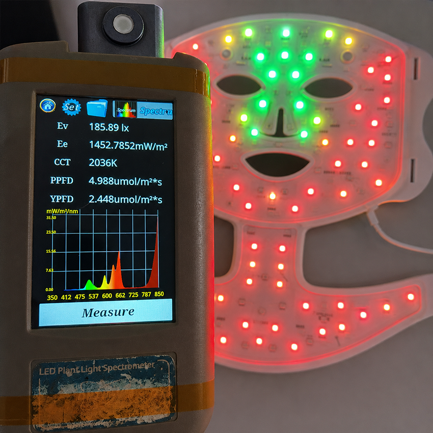 VanqHeal LED light therapy mask tested with spectrometer while red, green and yellow LEDs are illuminated