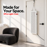 VanqHeal XPro red light therapy panel positioned in a home room to illustrate its tall, freestanding panel format.